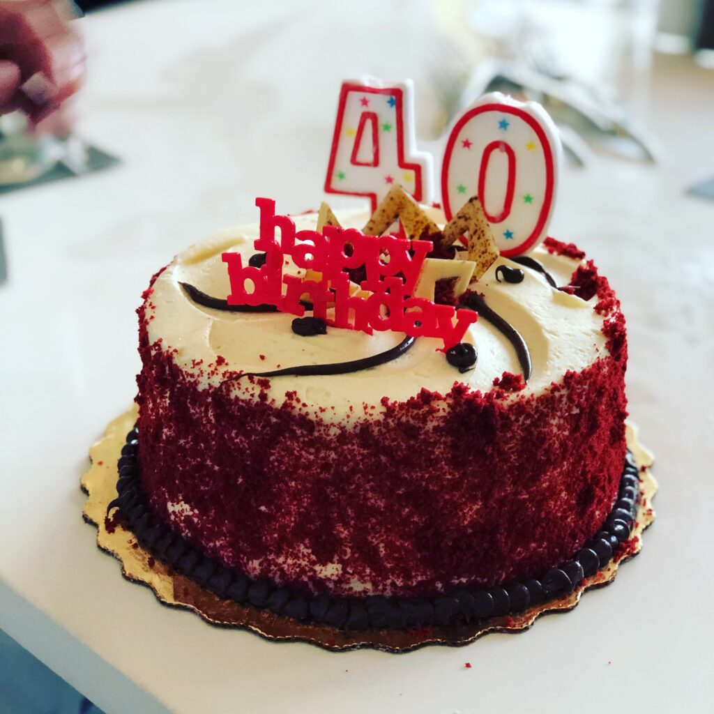 birthday cake with 40 on it. 40 is a common age for a midlife crisis.