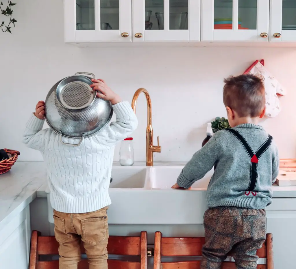 Magical weekly routine for kids, kids doing the dishes by standing on chairs