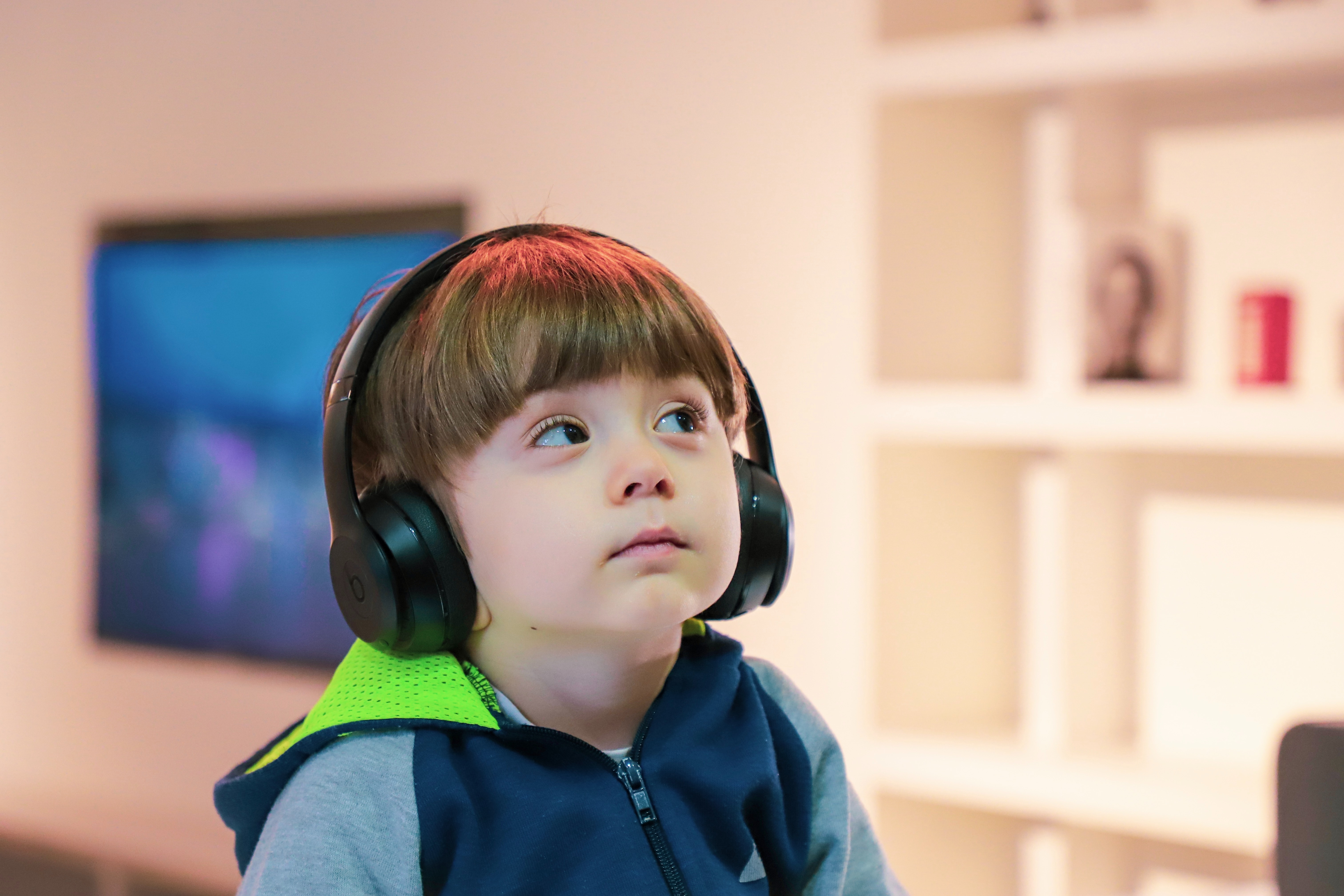 young boy listening to headspace app for kids